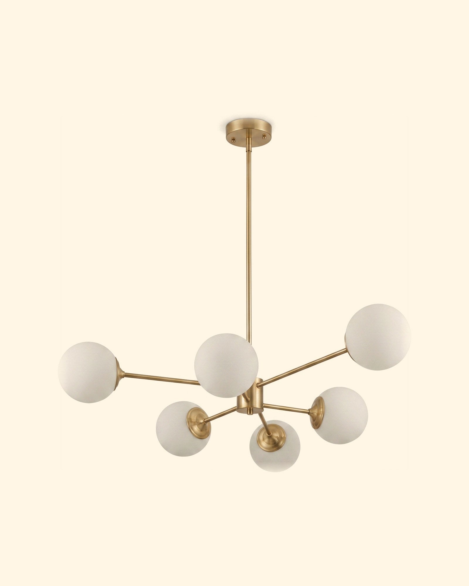 A cluster of glowing opal globe pendants above a dining table