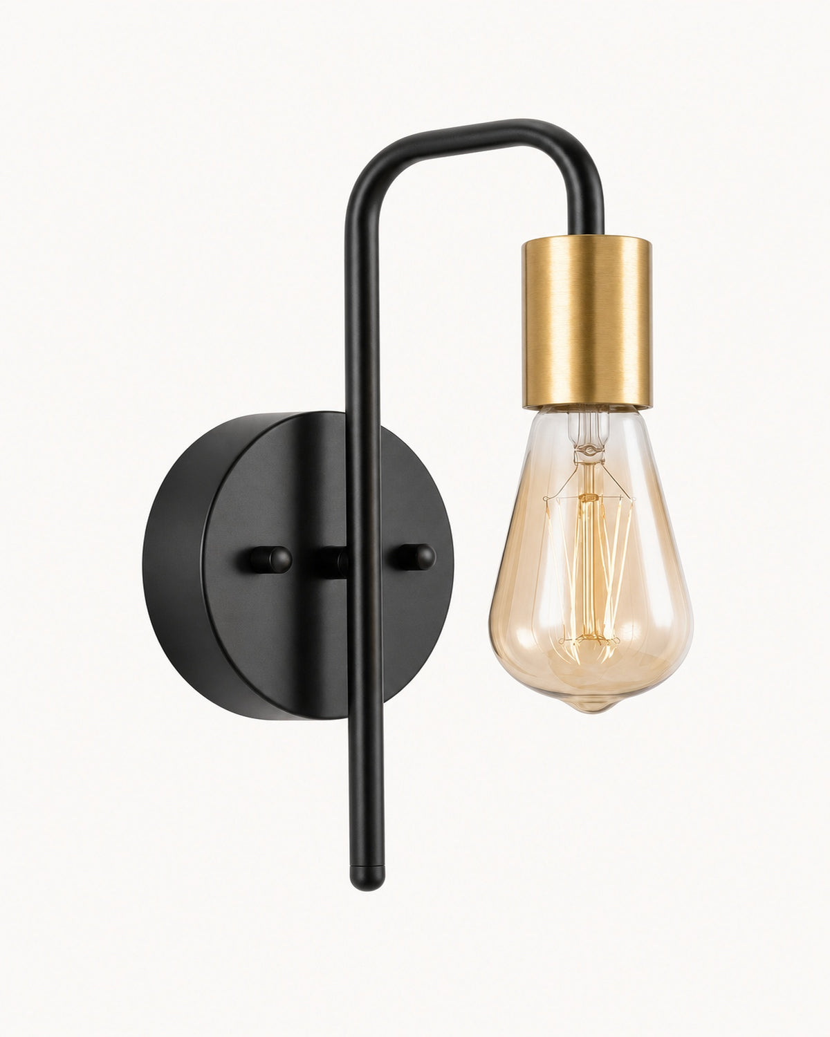 Bare bulb industrial wall light in black and gold: black arm and backplate, brushed gold lamp socket, amber Edison bulb