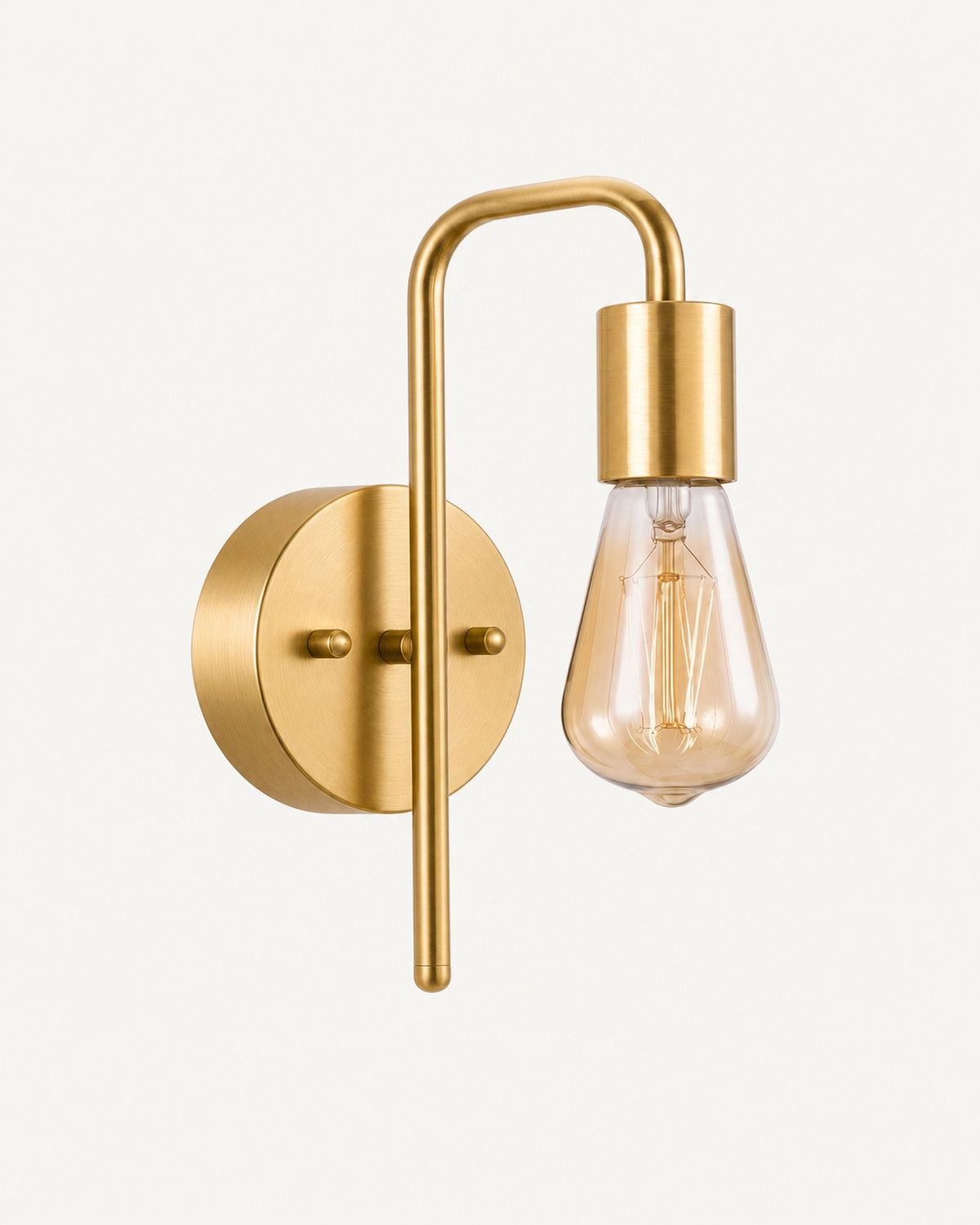 Bare bulb industrial wall light in all gold: brushed brass arm, backplate and socket, amber Edison bulb