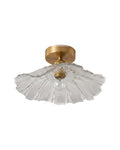 Antique brass semi-flush fluted glass ceiling light on a white background