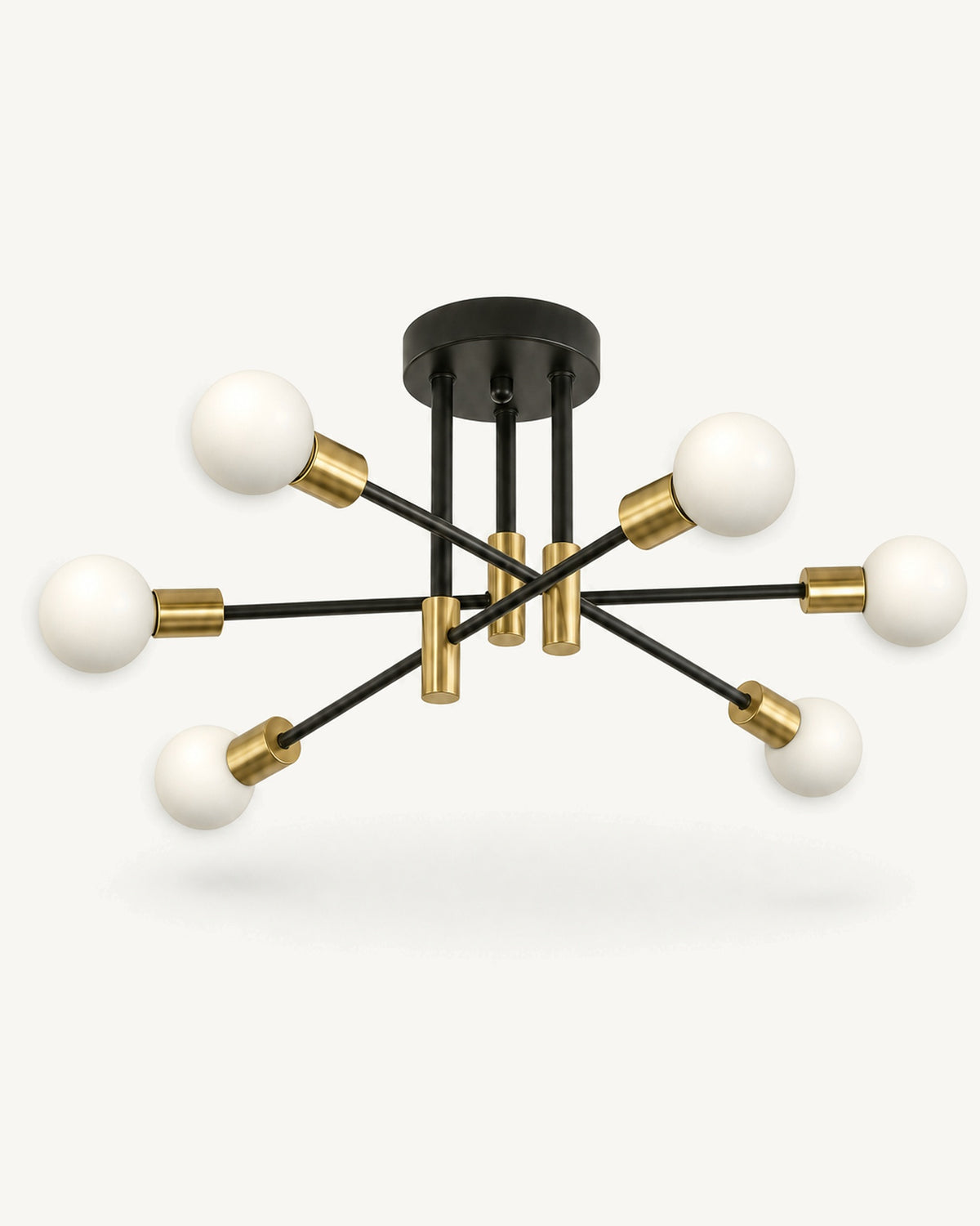 Nordic sputnik 6-light semi-flush ceiling light in black and gold, six frosted white globe bulbs on staggered black arms with brushed-gold sockets, on a pale studio background