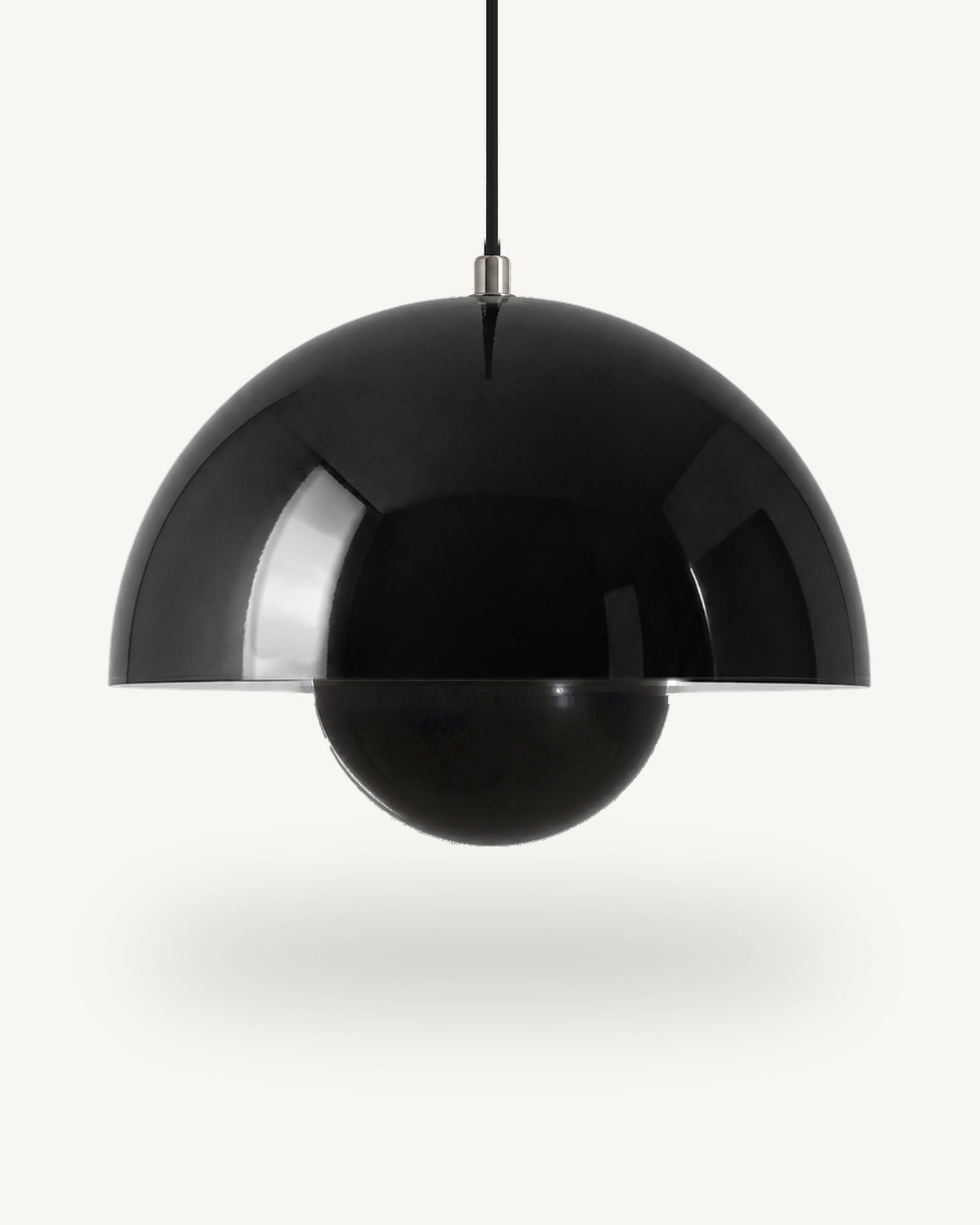 Modern iron dome pendant light in Black, its painted metal sphere sitting level with the shade rim