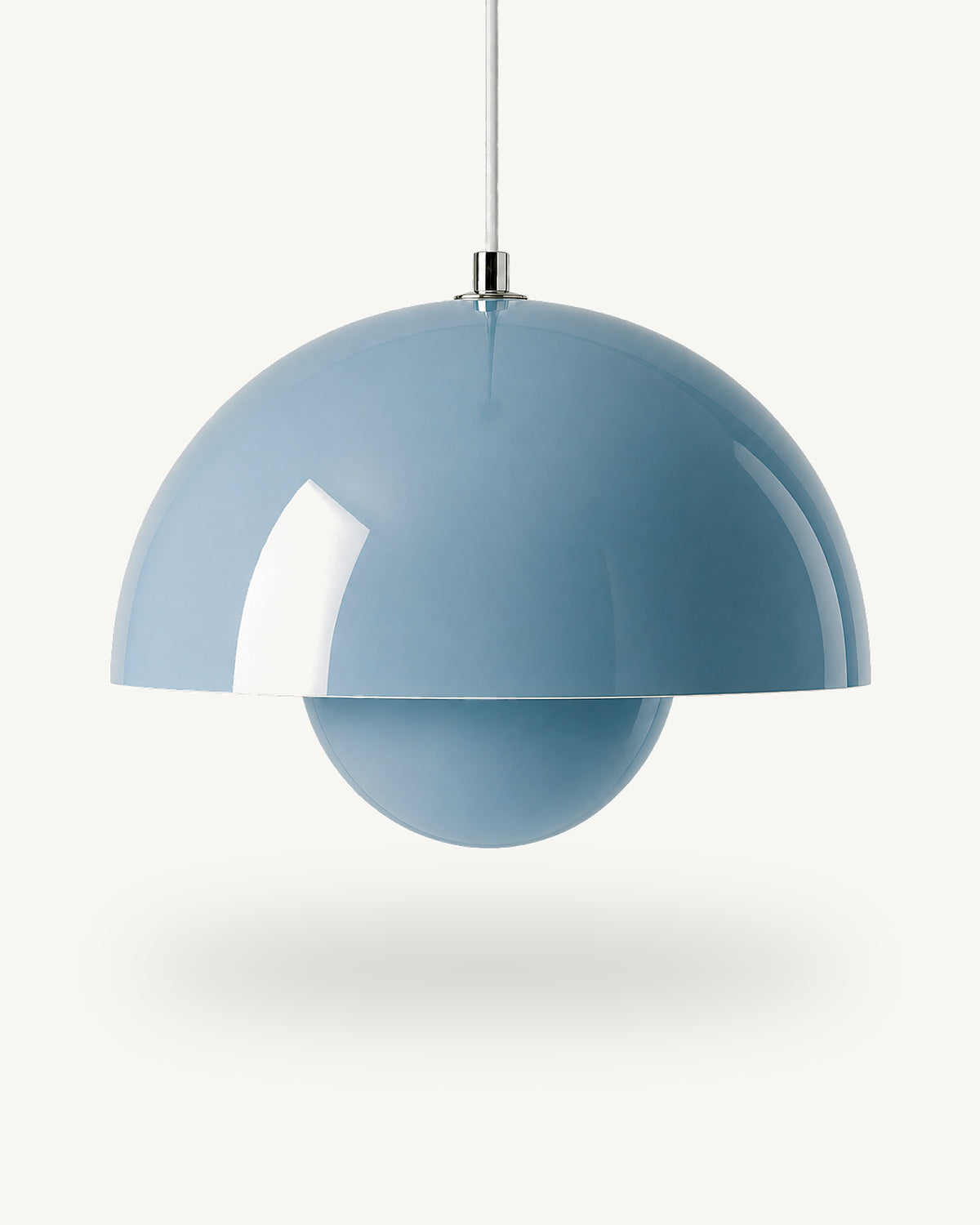 Modern iron dome pendant light in Blue, its painted metal sphere sitting level with the shade rim