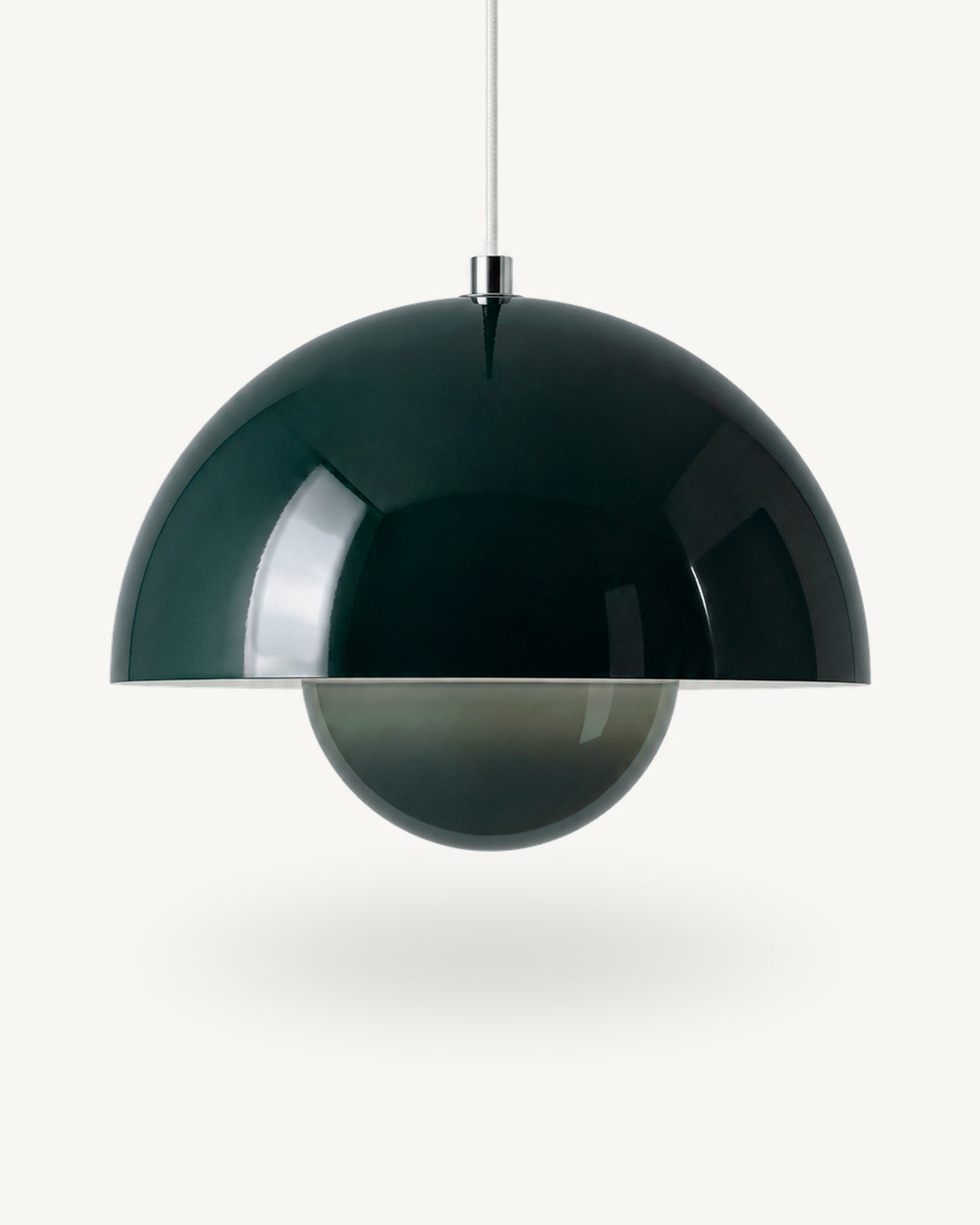 Modern iron dome pendant light in Dark green, its painted metal sphere sitting level with the shade rim