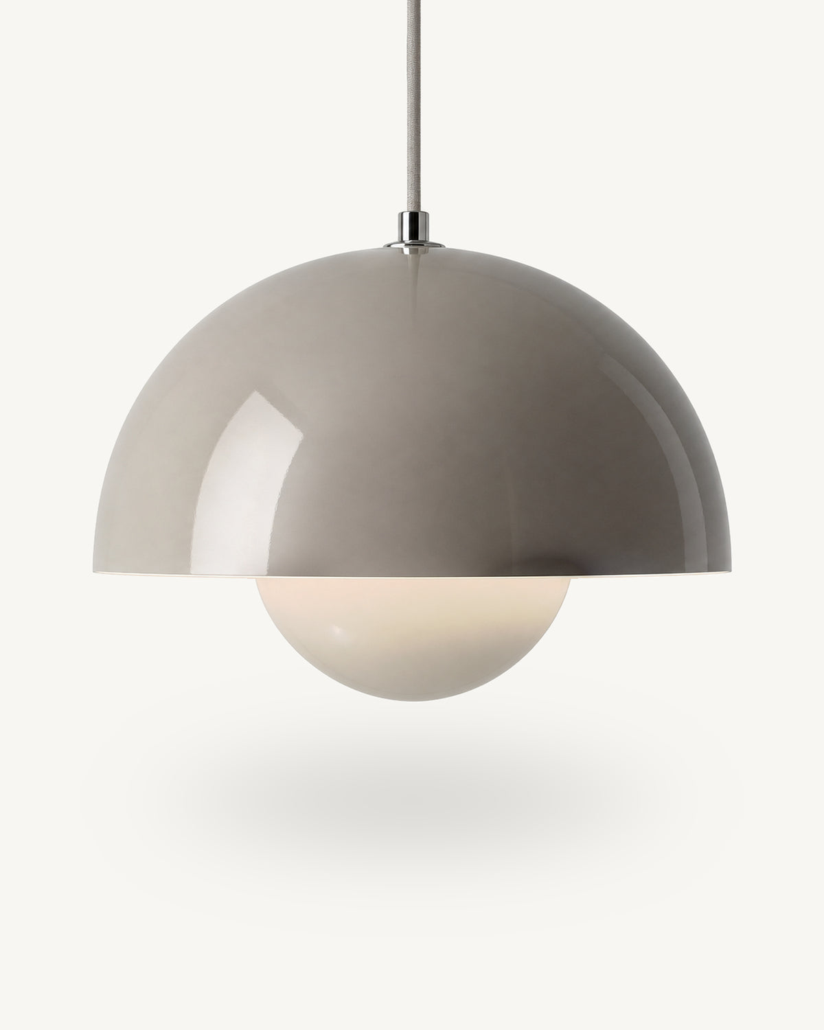 Modern iron dome pendant light in Grey, its painted metal sphere sitting level with the shade rim