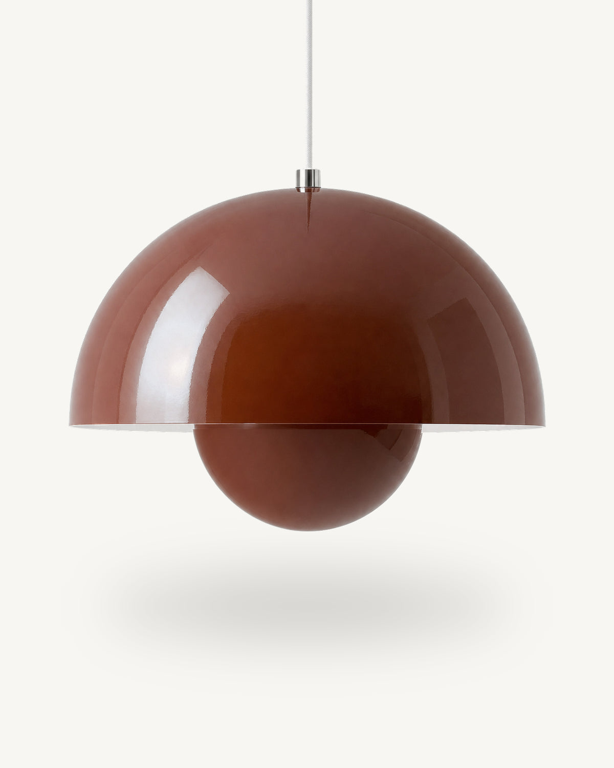 Modern iron dome pendant light in Red, its painted metal sphere sitting level with the shade rim