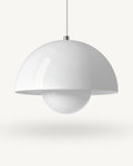 Modern iron dome pendant light in White, its painted metal sphere sitting level with the shade rim