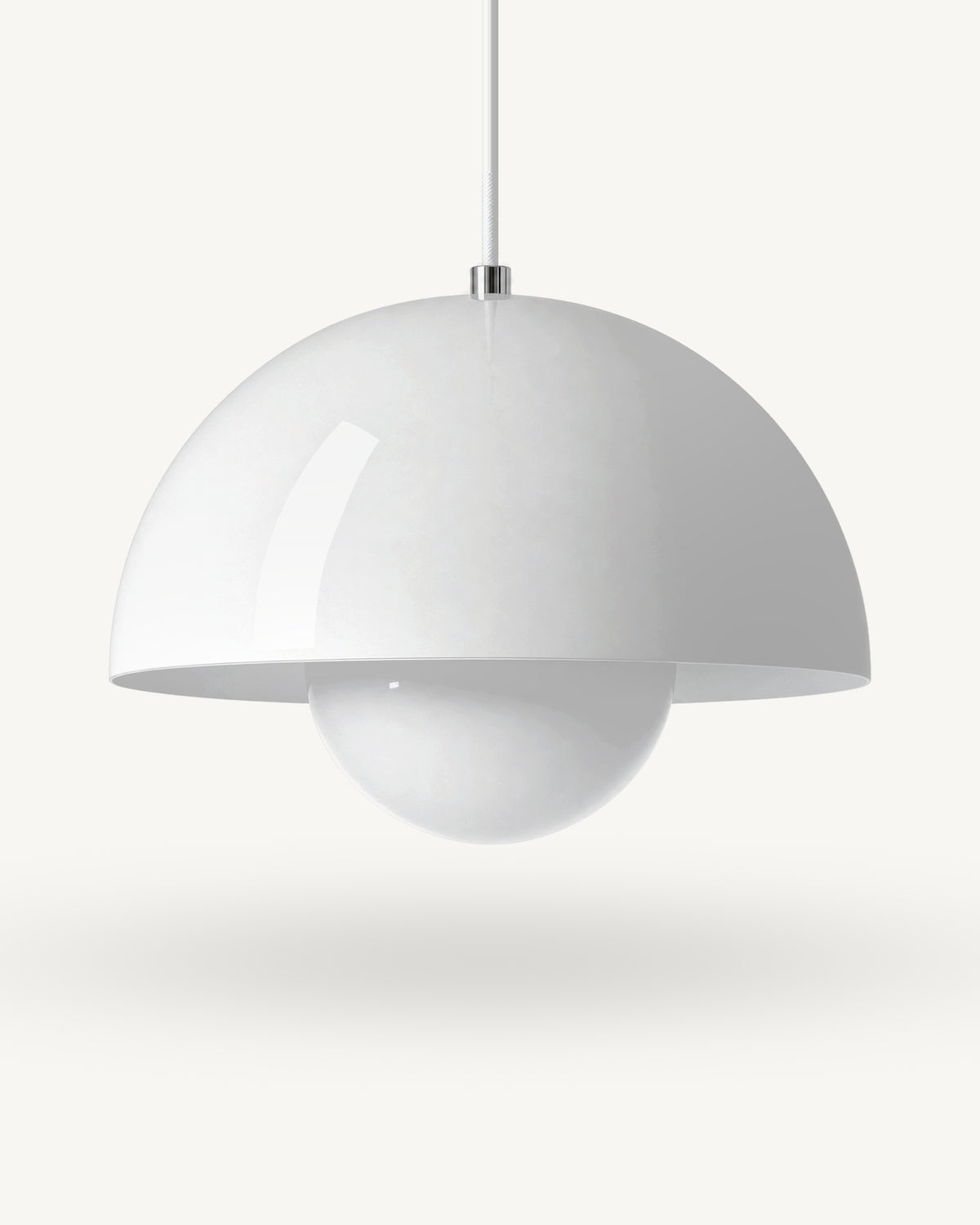 Modern iron dome pendant light in White, its painted metal sphere sitting level with the shade rim