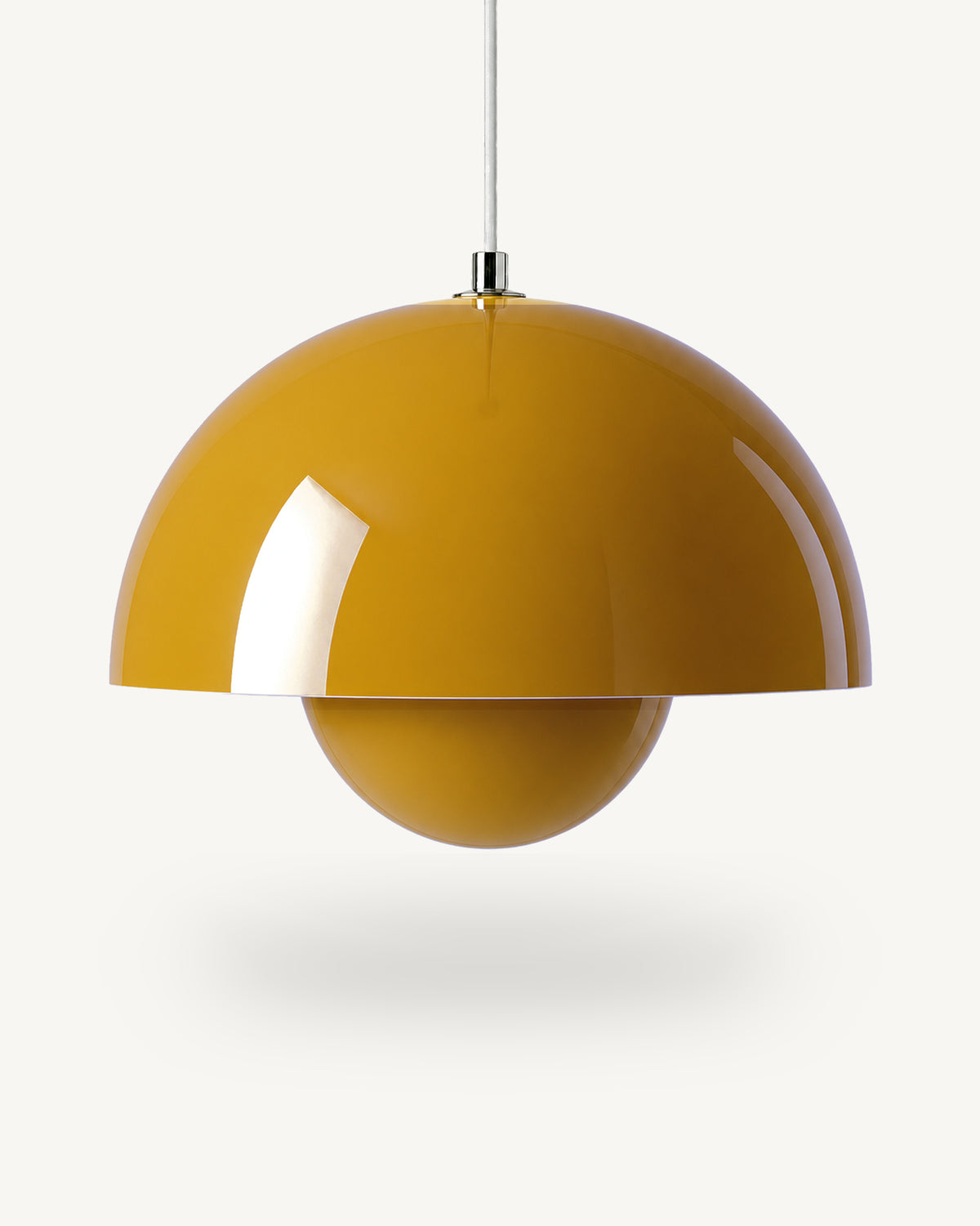 Modern iron dome pendant light in Yellow, its painted metal sphere sitting level with the shade rim