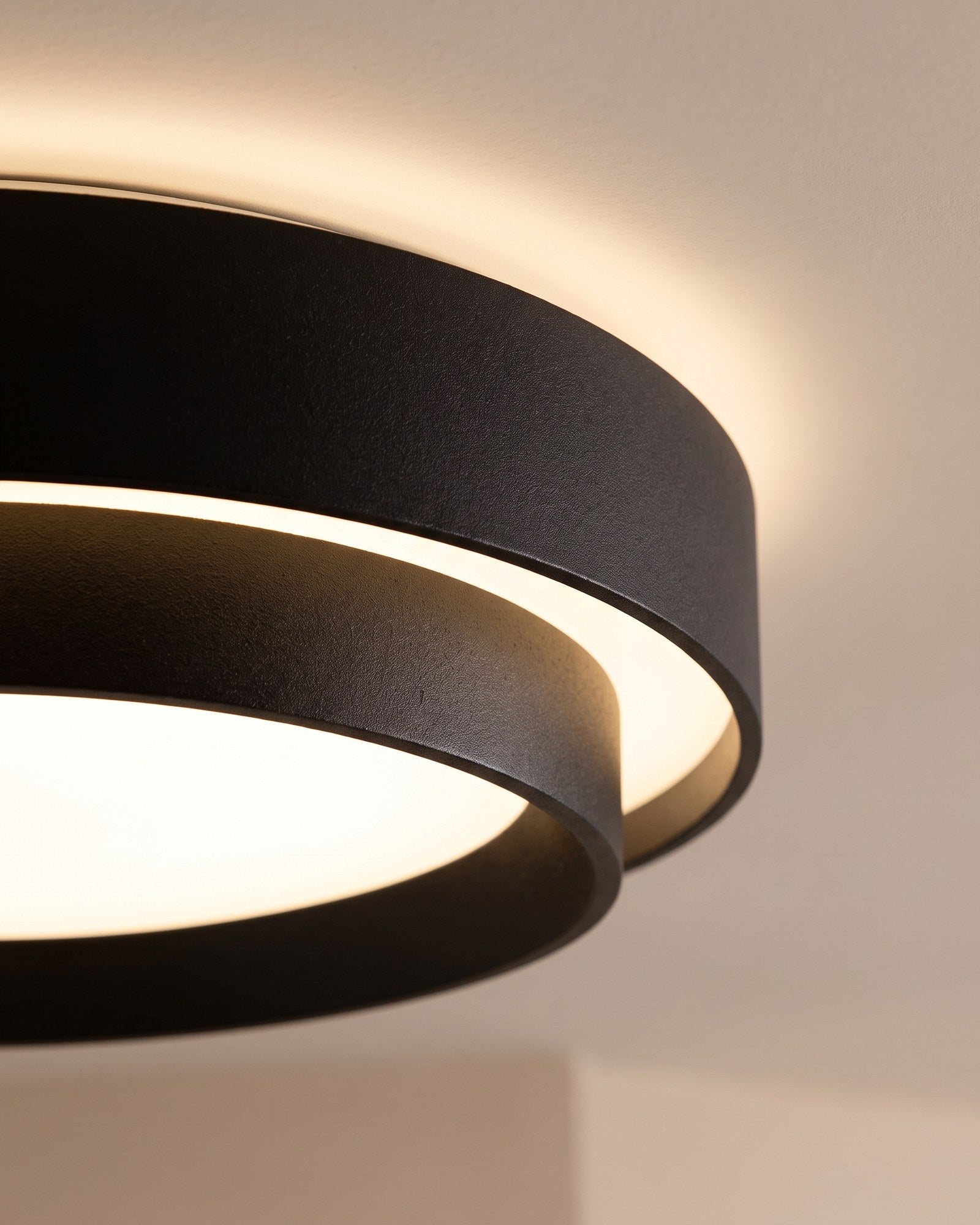 Macro of the matte black drum rim and the warm glow between its two rings