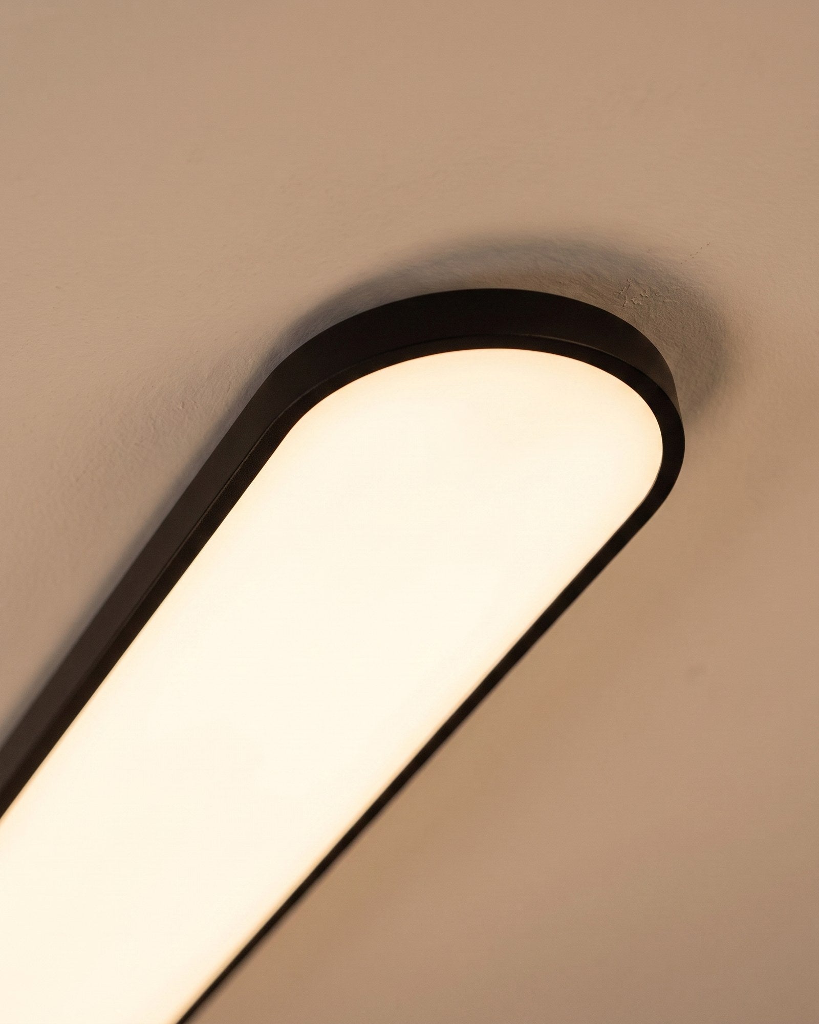 Macro of the slim black rim and evenly glowing diffuser face