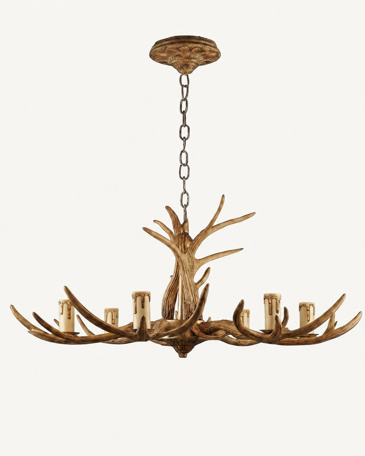 Rustic six-light antler chandelier, unlit: tan resin antler arms, cream candle sleeves, chain and carved ceiling rose